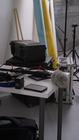 Vertical-Video-Of-Film-Sound-Recording-Equipment-With-Microphone-Boom-Pole-And-Wind-Muff-Shooting-Movie-In-Studio